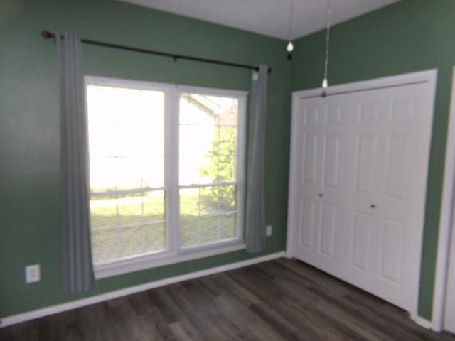 801 Laurel Hill Dr Unit 801, Old Hickory, TN 37138 - unfurnished bedroom with baseboards, a closet, and dark wood-type flooring