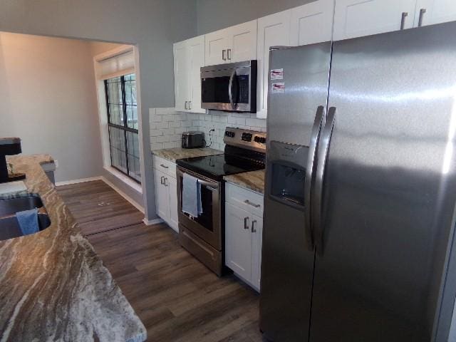 801 Laurel Hill Dr Unit 801, Old Hickory, TN 37138 - kitchen with backsplash, baseboards, white cabinets, stainless steel appliances, and dark wood-type flooring