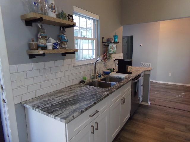 801 Laurel Hill Dr Unit 801, Old Hickory, TN 37138 - kitchen with backsplash, dark wood-style flooring, dishwasher, a sink, and white cabinets
