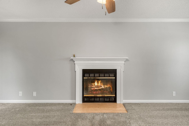 details with a glass covered fireplace, crown molding, a ceiling fan, and a textured ceiling