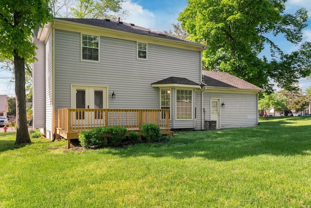 back of house with french doors, central air condition unit, a yard, and a deck