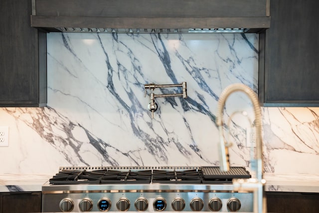 details featuring dark brown cabinetry, backsplash, and stove