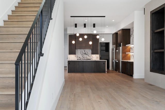 stairway featuring wood finished floors