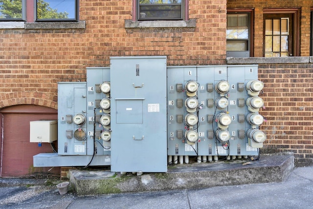 details with electric meter and brick siding