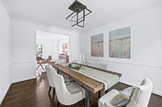 dining area with baseboards, ornamental molding, and dark wood-style floors