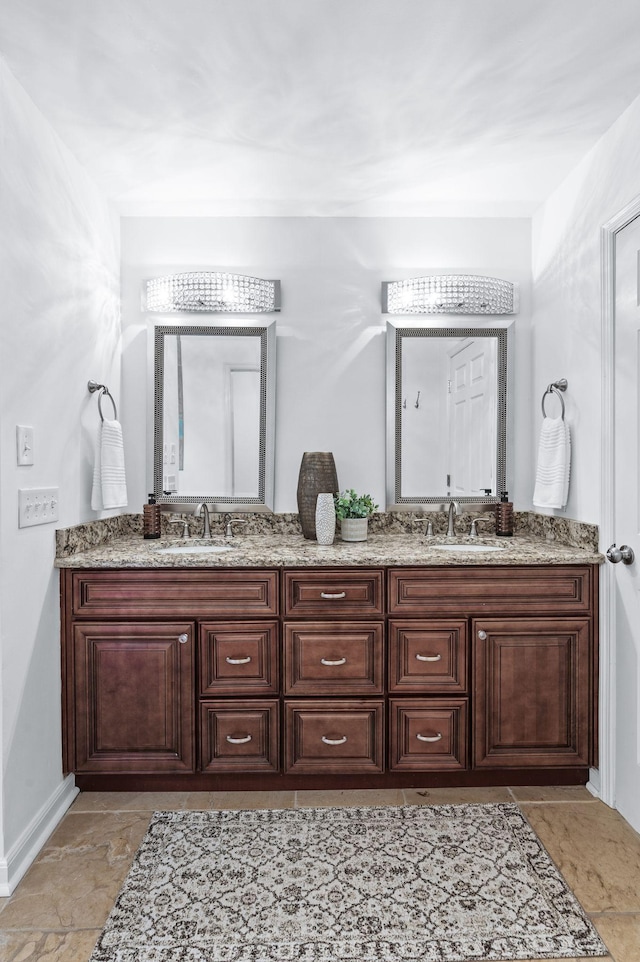 full bath featuring double vanity and a sink