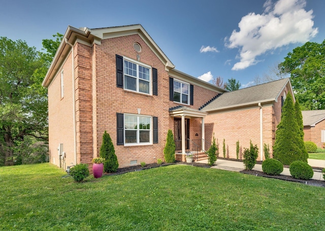 view of front of property featuring crawl space, a front lawn, and brick siding