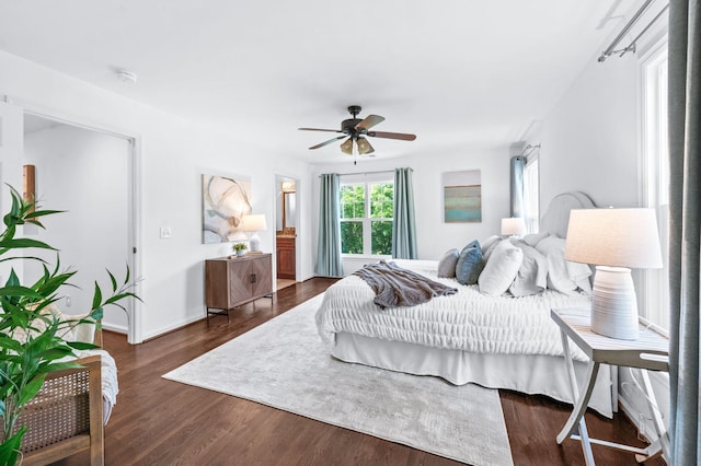 bedroom with a ceiling fan, baseboards, and wood finished floors