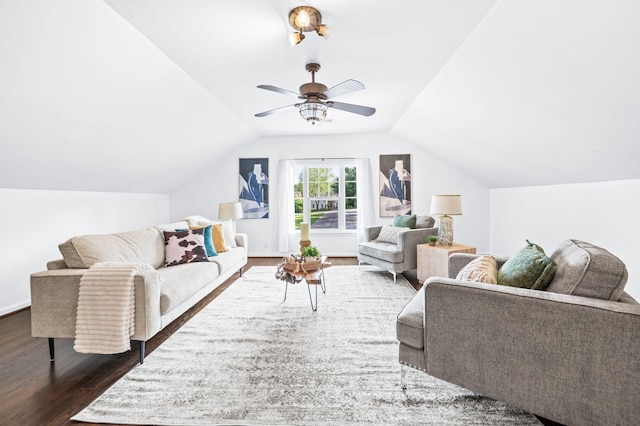 living room with dark wood-style flooring, ceiling fan, and vaulted ceiling