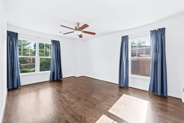 empty room featuring ceiling fan and wood finished floors