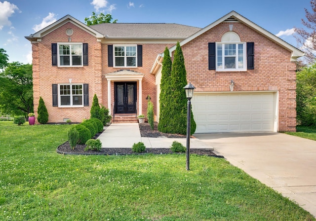 view of front of property with a garage, concrete driveway, brick siding, and a front yard