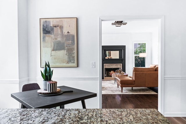 corridor featuring dark wood-style floors