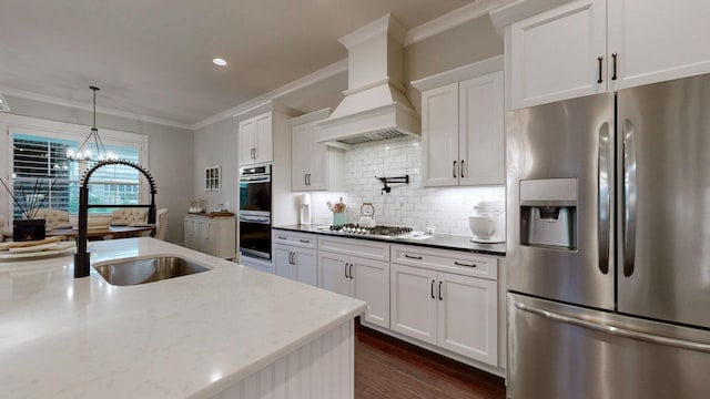 8119 Schweitzer Pl, Arrington, TN 37014 - kitchen with crown molding, white cabinetry, appliances with stainless steel finishes, and a sink