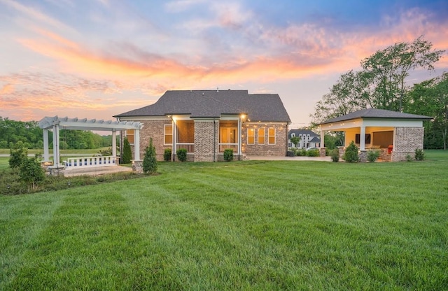 8119 Schweitzer Pl, Arrington, TN 37014 - rear view of property with brick siding, a lawn, a pergola, and a patio