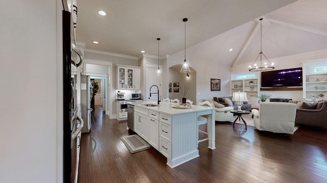 8119 Schweitzer Pl, Arrington, TN 37014 - kitchen with a breakfast bar area, stainless steel dishwasher, a sink, white cabinets, and open floor plan