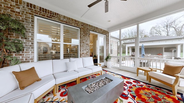 8119 Schweitzer Pl, Arrington, TN 37014 - sunroom with an outdoor living space with a fire pit and ceiling fan