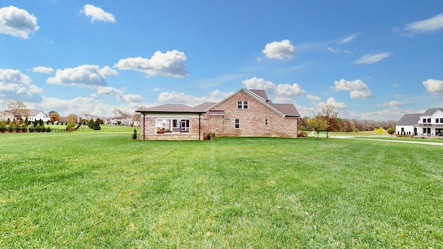 8119 Schweitzer Pl, Arrington, TN 37014 - rear view of house with a yard and brick siding