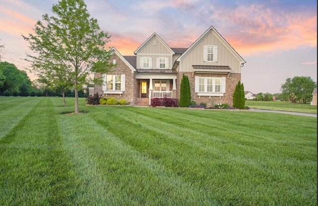 8119 Schweitzer Pl, Arrington, TN 37014 - craftsman-style home featuring a yard, a standing seam roof, metal roof, and covered porch