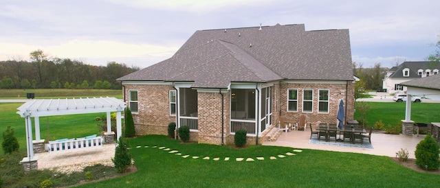 8119 Schweitzer Pl, Arrington, TN 37014 - rear view of property with a pergola, a shingled roof, brick siding, a patio area, and a lawn