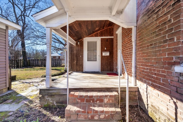 207 Dunlap St, Paris, TN 38242 - doorway to property with brick siding and fence