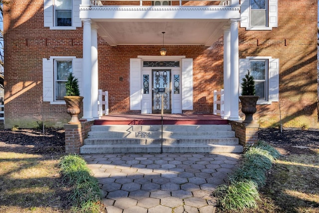 207 Dunlap St, Paris, TN 38242 - doorway to property featuring a porch and brick siding