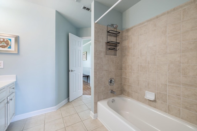 bathroom with shower / tub combination, vanity, tile patterned floors, baseboards, and visible vents