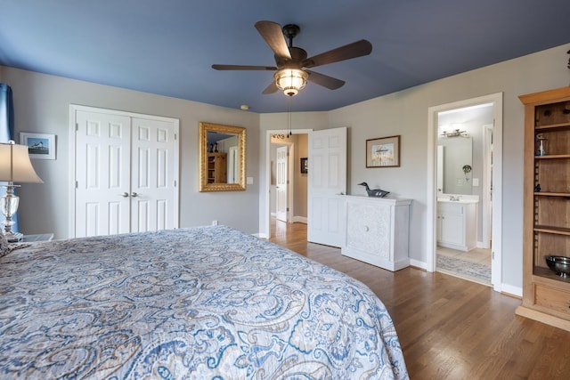 bedroom featuring baseboards, ceiling fan, a closet, and wood finished floors