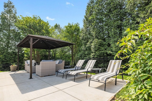 view of patio with a gazebo and an outdoor living space