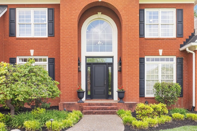 property entrance with brick siding