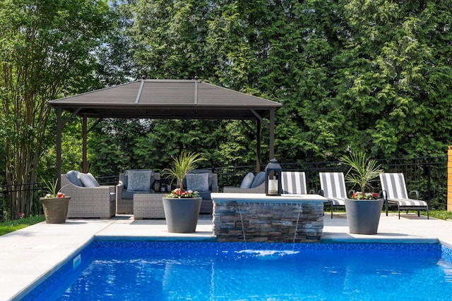 view of pool featuring a gazebo, fence, an outdoor hangout area, and a patio area