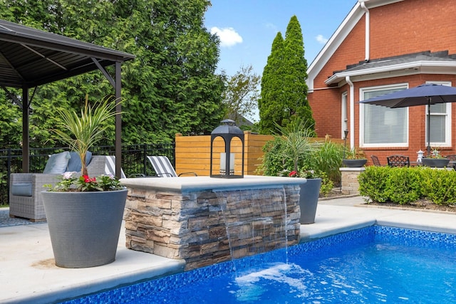 view of pool featuring a patio, fence, and a fenced in pool