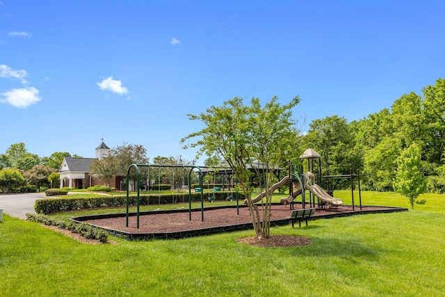 community playground featuring a lawn