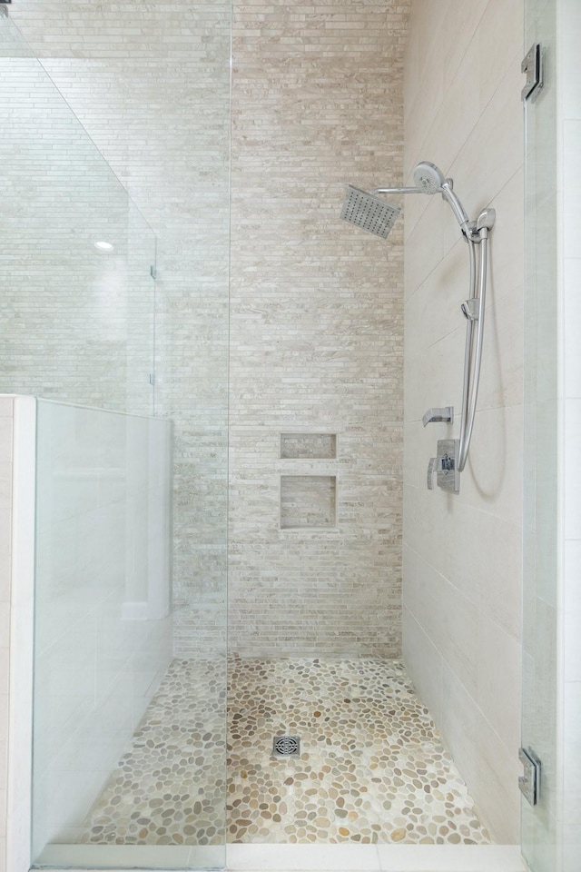 bathroom with a shower stall