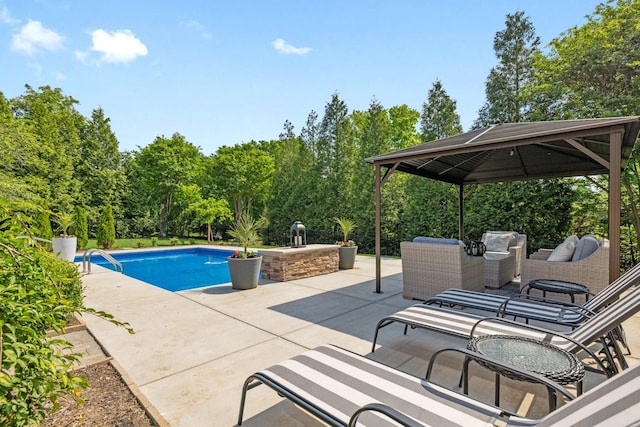 pool featuring a patio and a gazebo