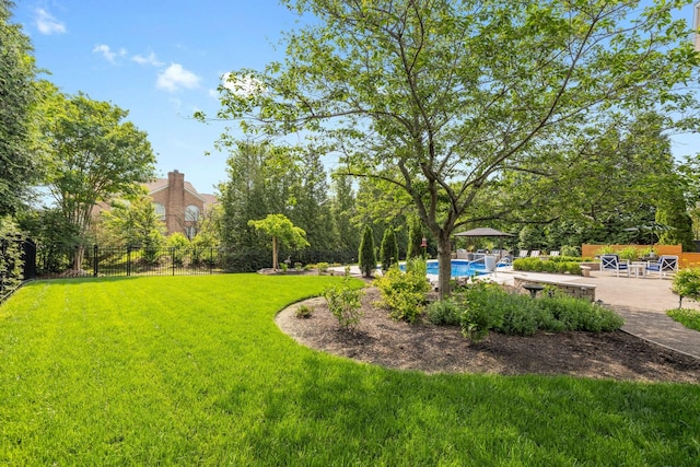 view of yard with a fenced in pool, a patio area, and fence