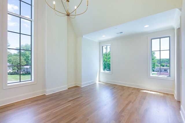 111 Keyway Dr, Nashville, TN 37205 - empty room with light wood finished floors, baseboards, and a chandelier