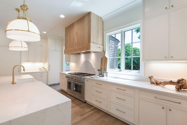 111 Keyway Dr, Nashville, TN 37205 - kitchen featuring double oven range, a sink, premium range hood, light wood finished floors, and white cabinetry