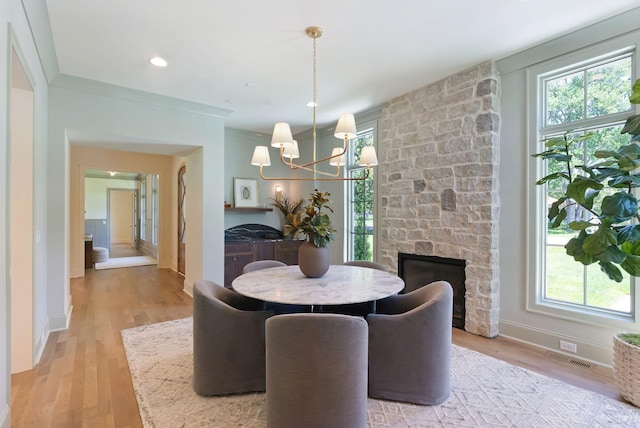 111 Keyway Dr, Nashville, TN 37205 - dining room featuring a chandelier, light wood-style floors, baseboards, and a fireplace