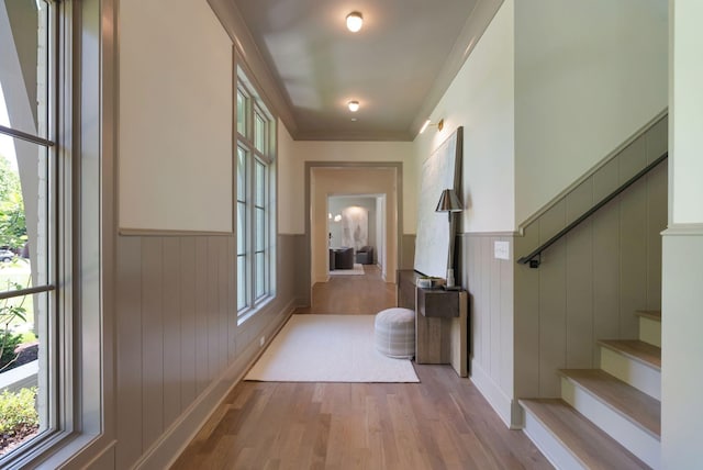 111 Keyway Dr, Nashville, TN 37205 - hallway featuring a wainscoted wall, wood finished floors, stairs, and crown molding