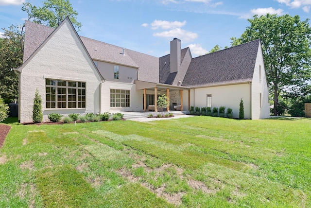111 Keyway Dr, Nashville, TN 37205 - back of house with a chimney, a lawn, and roof with shingles