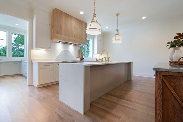 111 Keyway Dr, Nashville, TN 37205 - kitchen featuring a sink, light countertops, light wood finished floors, recessed lighting, and custom range hood
