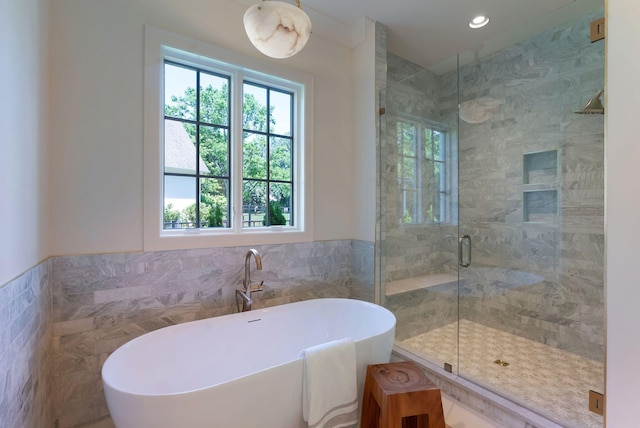 111 Keyway Dr, Nashville, TN 37205 - bathroom featuring tile walls, a stall shower, a soaking tub, a wainscoted wall, and recessed lighting