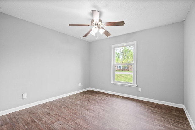 3404 Albert Dr, Clarksville, TN 37042 - empty room featuring dark wood-style flooring, baseboards, visible vents, and ceiling fan