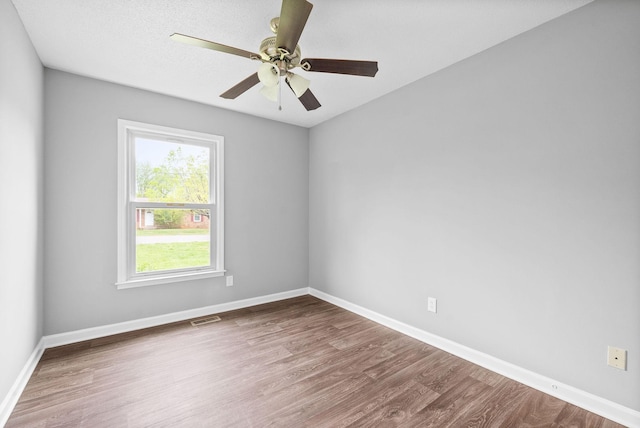 3404 Albert Dr, Clarksville, TN 37042 - empty room with visible vents, a ceiling fan, baseboards, and wood finished floors