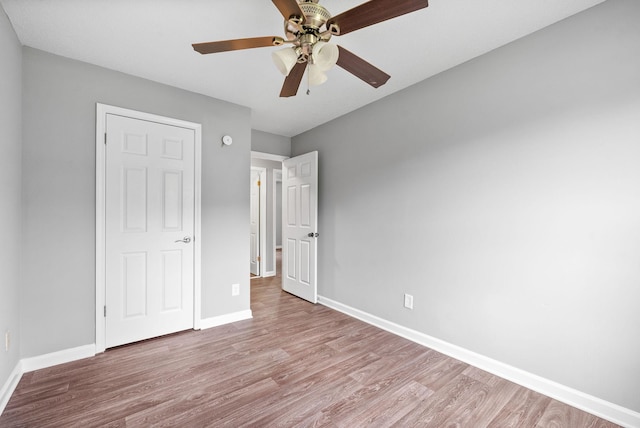 3404 Albert Dr, Clarksville, TN 37042 - unfurnished bedroom with baseboards, ceiling fan, and wood finished floors