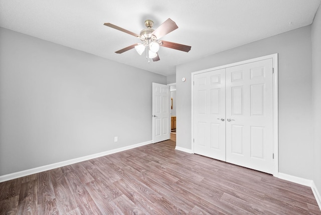 3404 Albert Dr, Clarksville, TN 37042 - unfurnished bedroom with a ceiling fan, baseboards, wood finished floors, and a closet