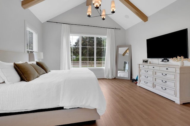 bedroom with an inviting chandelier, high vaulted ceiling, light wood-style flooring, and beam ceiling