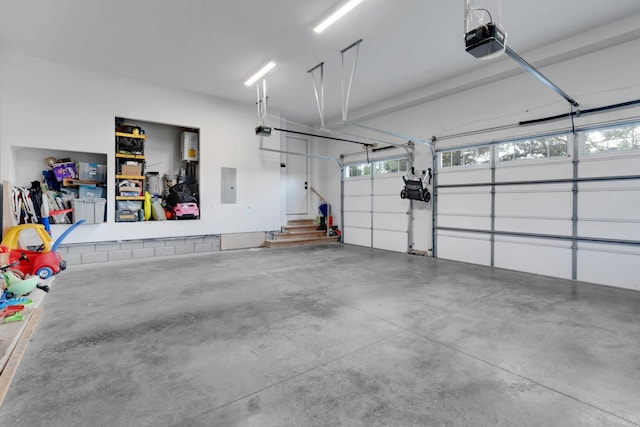 garage featuring a garage door opener and electric panel