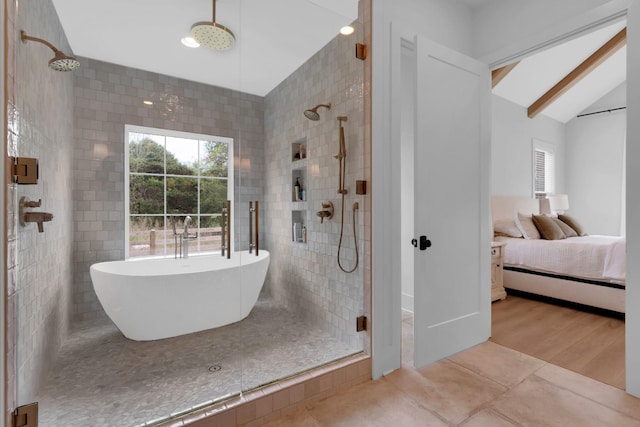 ensuite bathroom featuring tile patterned flooring, a stall shower, ensuite bath, and a healthy amount of sunlight