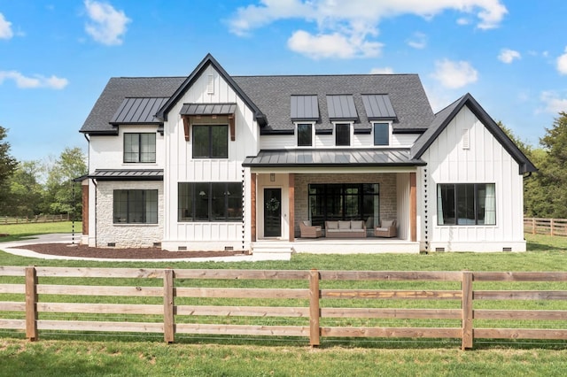 modern farmhouse style home with a standing seam roof, board and batten siding, a porch, and crawl space